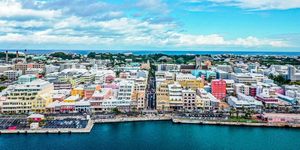 Bermuda travel guide city buildings near body of water under blue sky during daytime