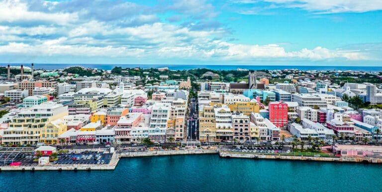 Bermuda travel guide city buildings near body of water under blue sky during daytime