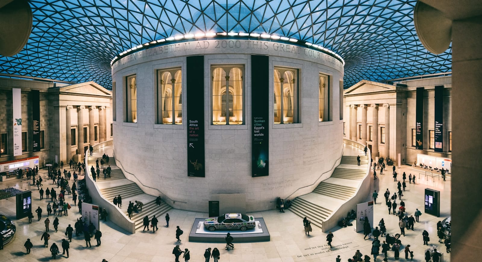 British Museum Tours a group of people standing around a building