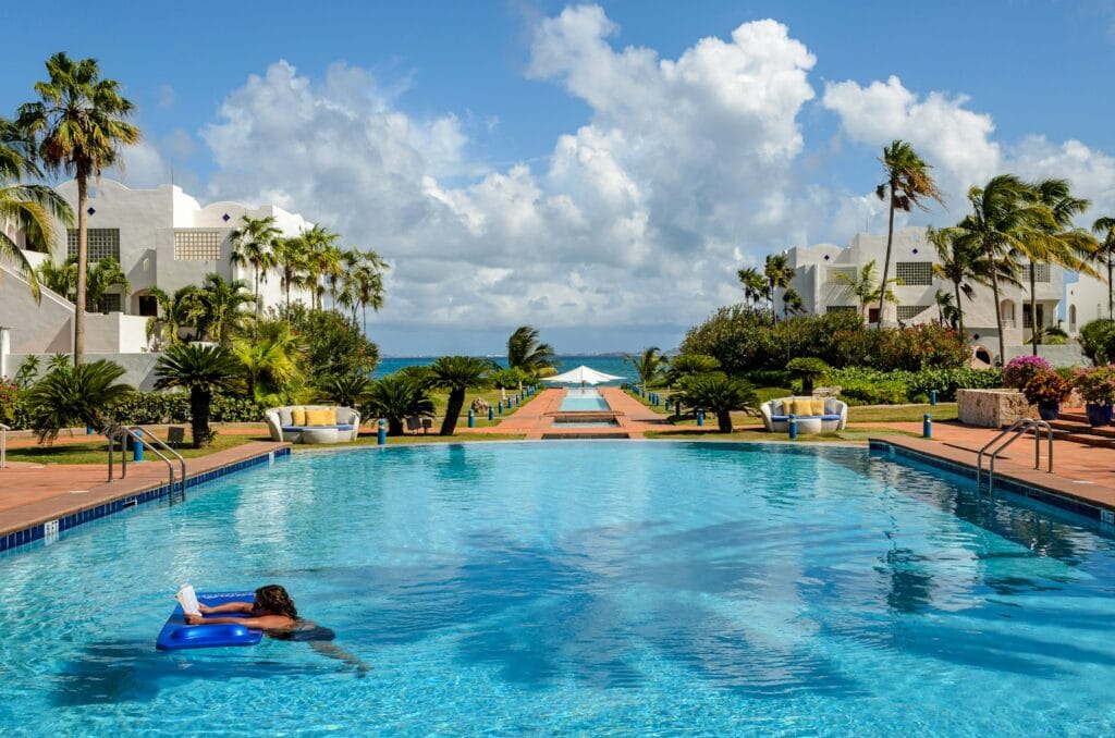 Anguilla Tours A large swimming pool surrounded by palm trees