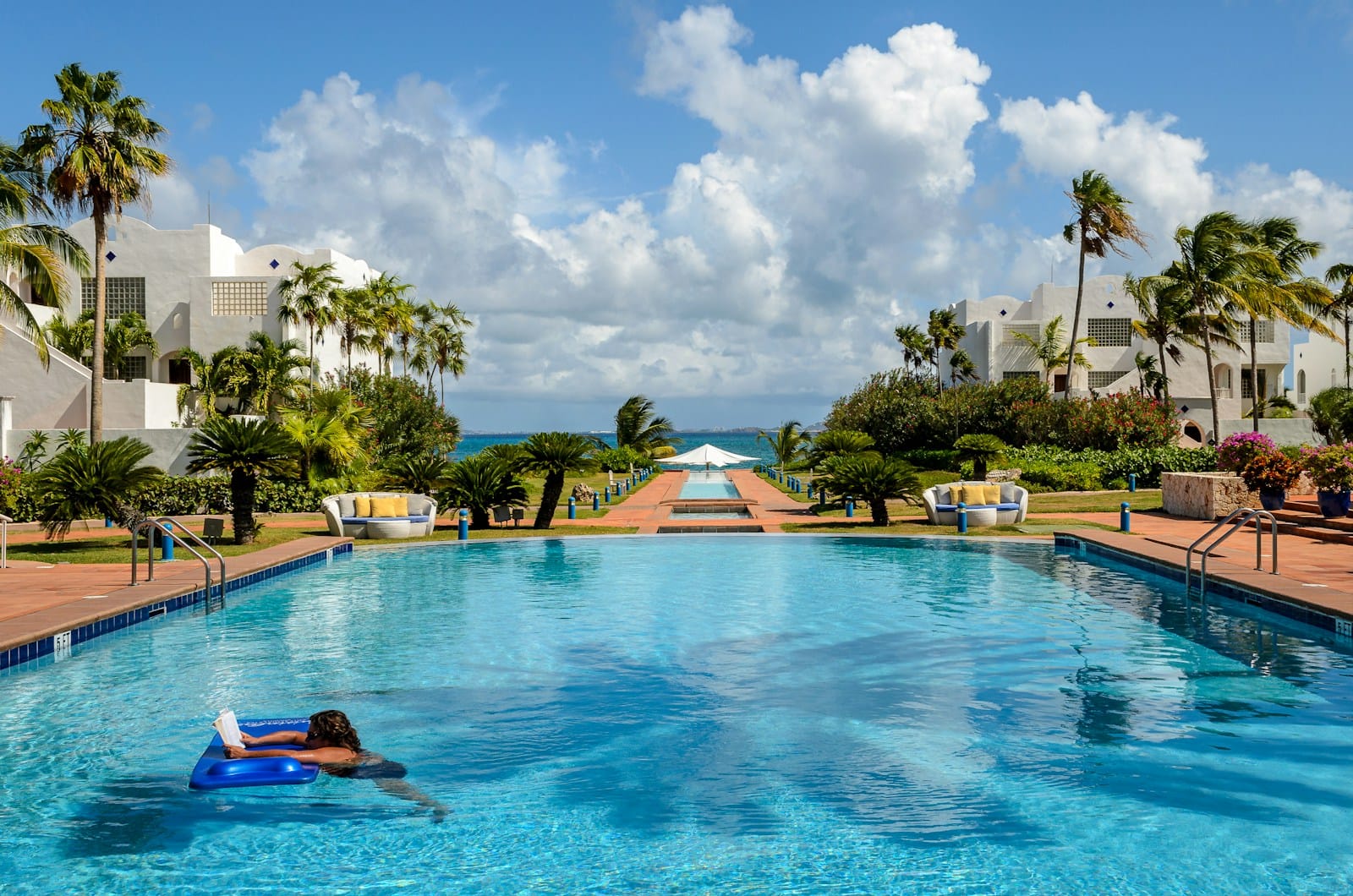 Anguilla Tours A large swimming pool surrounded by palm trees
