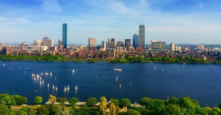 Boston Travel Guide body of water near cityscape at daytime