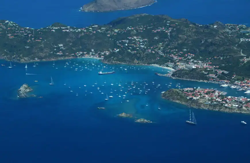 St Kitts and Nevis Tours an aerial view of a small island with boats in the water