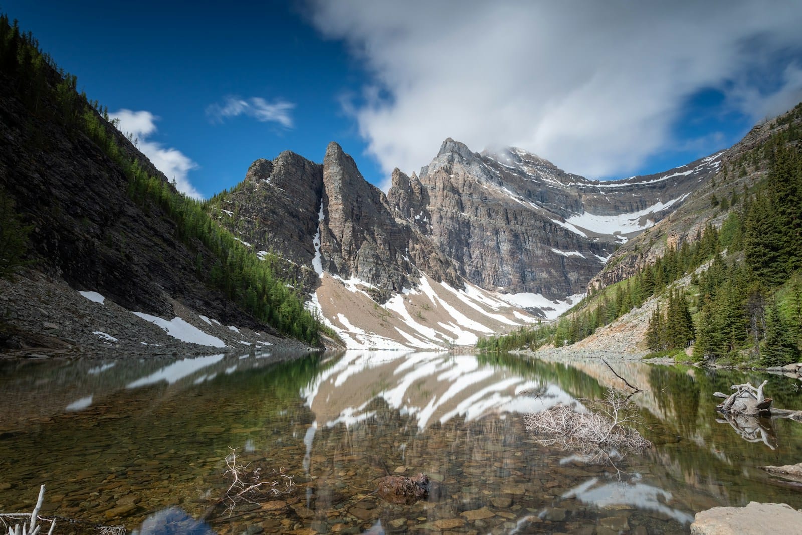 Explore North America mountains under blue sky and white clouds
