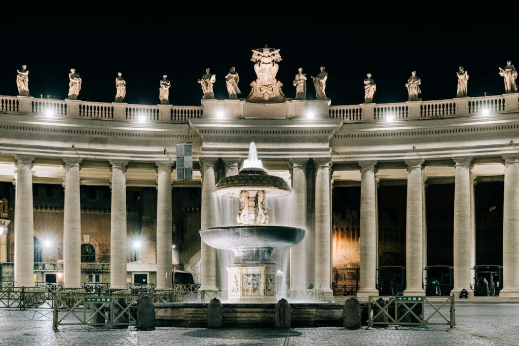 St Peters Square water fountain in front of building during night time