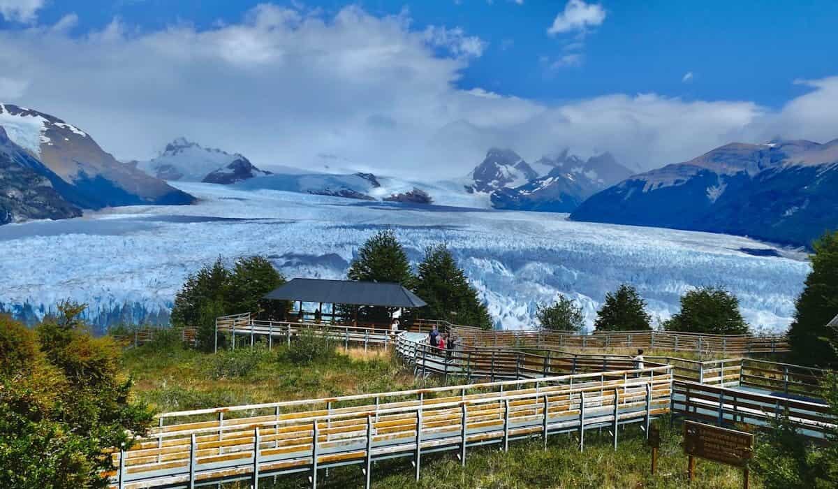 Argentina Travel Guide a group of people standing on top of a lush green hillside