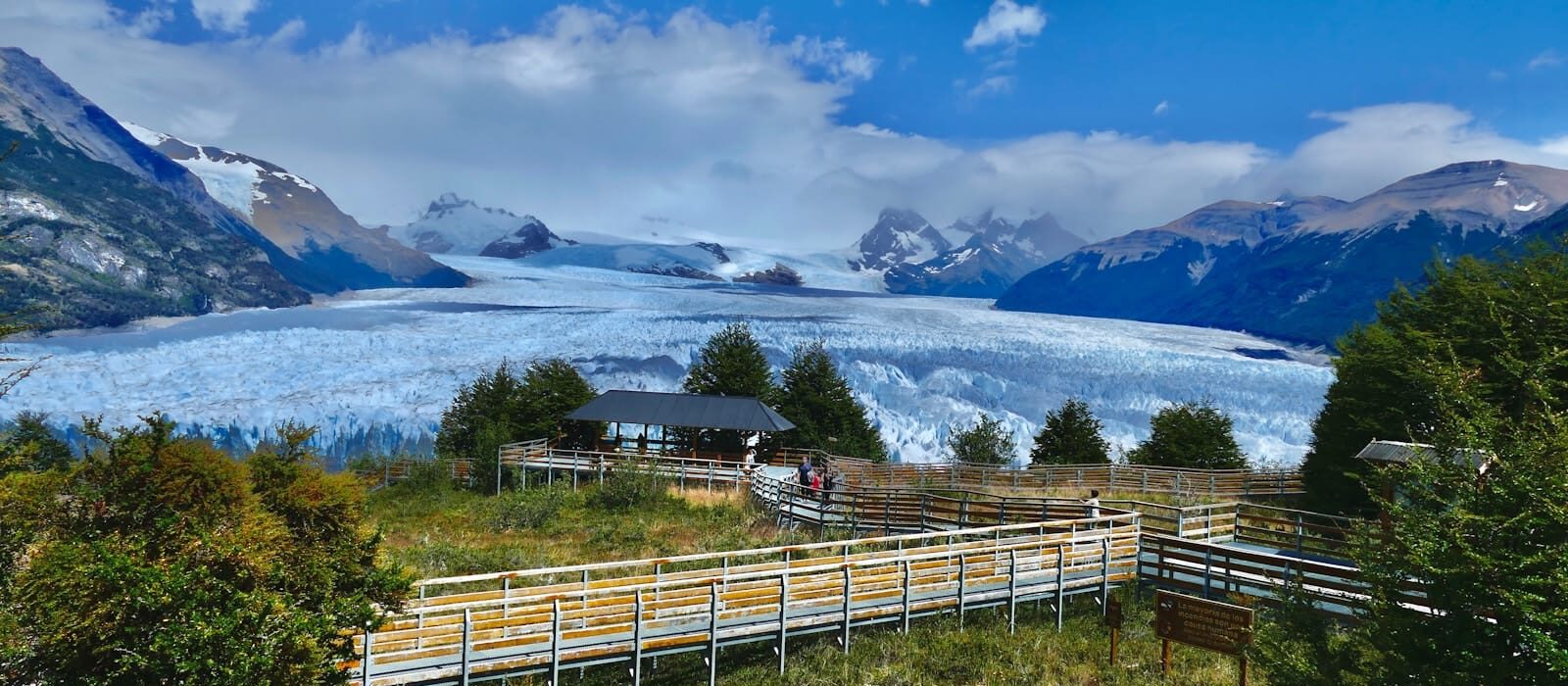 Argentina Travel Guide a group of people standing on top of a lush green hillside