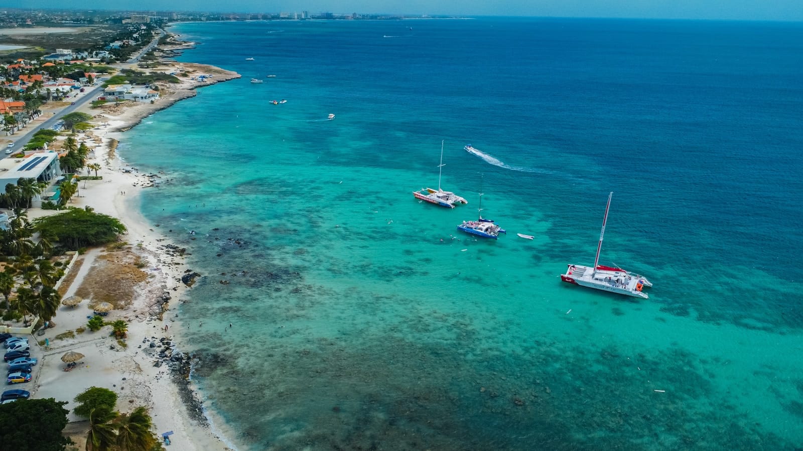 Aruba Tours a couple of boats that are in the water