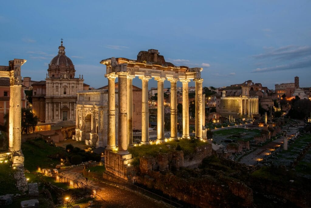 Roman Forum the ruins of a roman city lit up at night roman forum travel guide