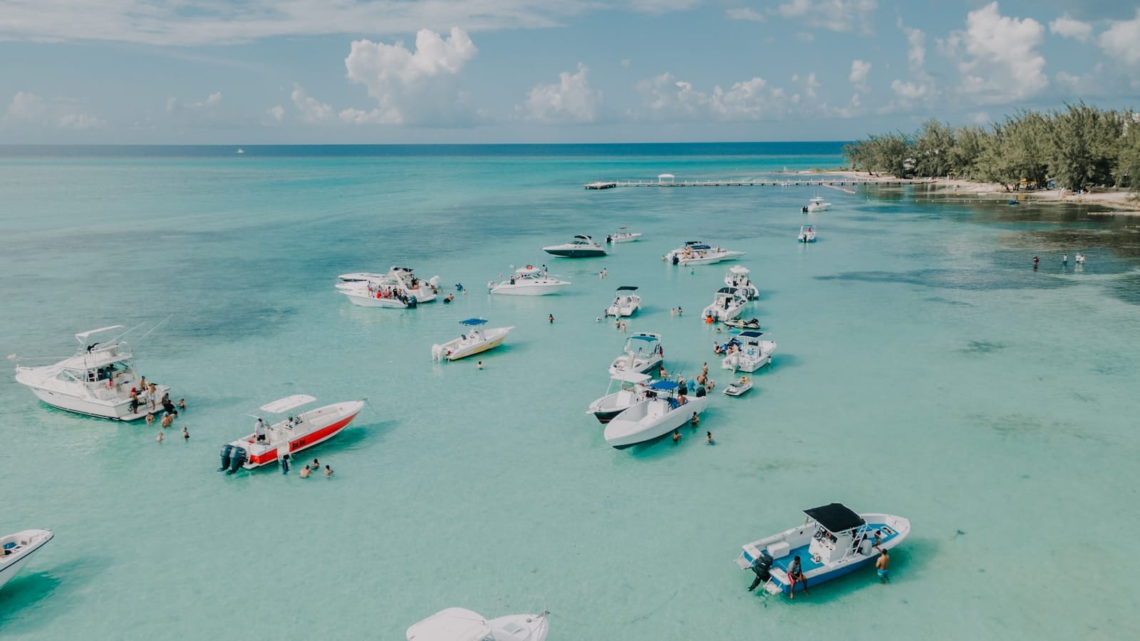 Cayman Islands Tours white and red boats on sea during daytime