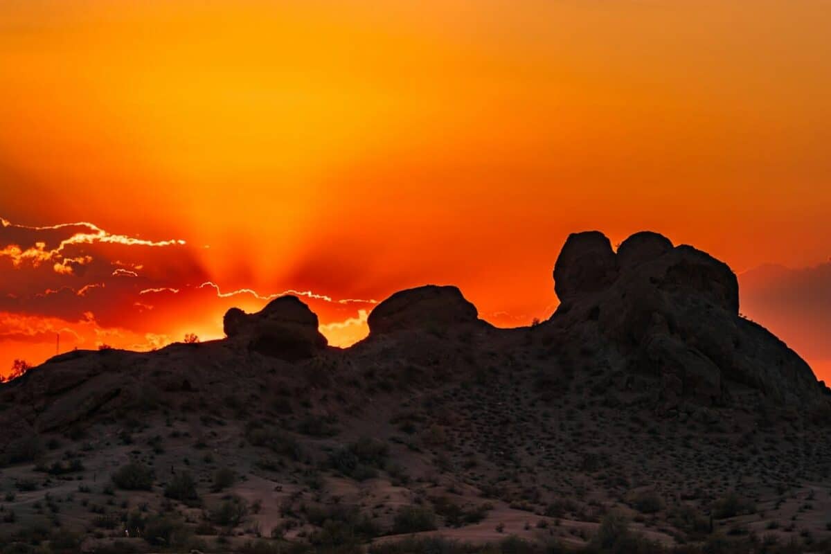 phoenix travel guide The sun is setting over the mountains in the desert