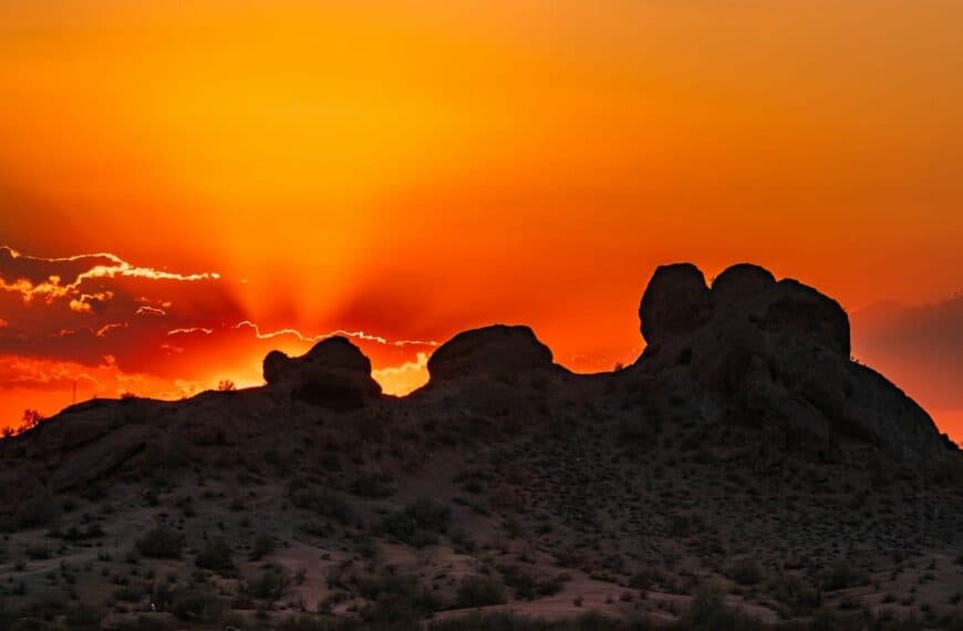 phoenix travel guide The sun is setting over the mountains in the desert