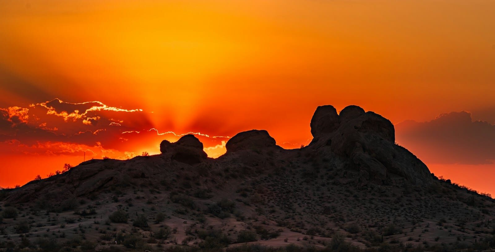 phoenix travel guide The sun is setting over the mountains in the desert