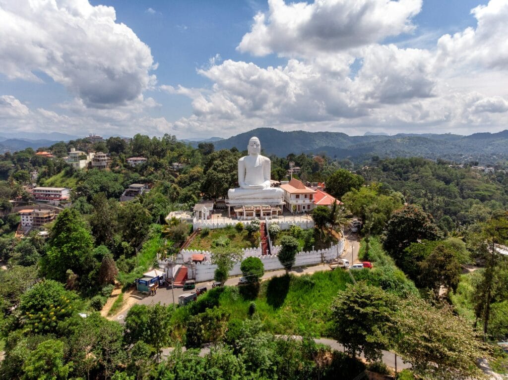 Sri Lanka Travel Guide Gautama Buddha statue under white clouds