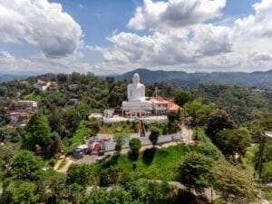 Sri Lanka Travel Guide Gautama Buddha statue under white clouds