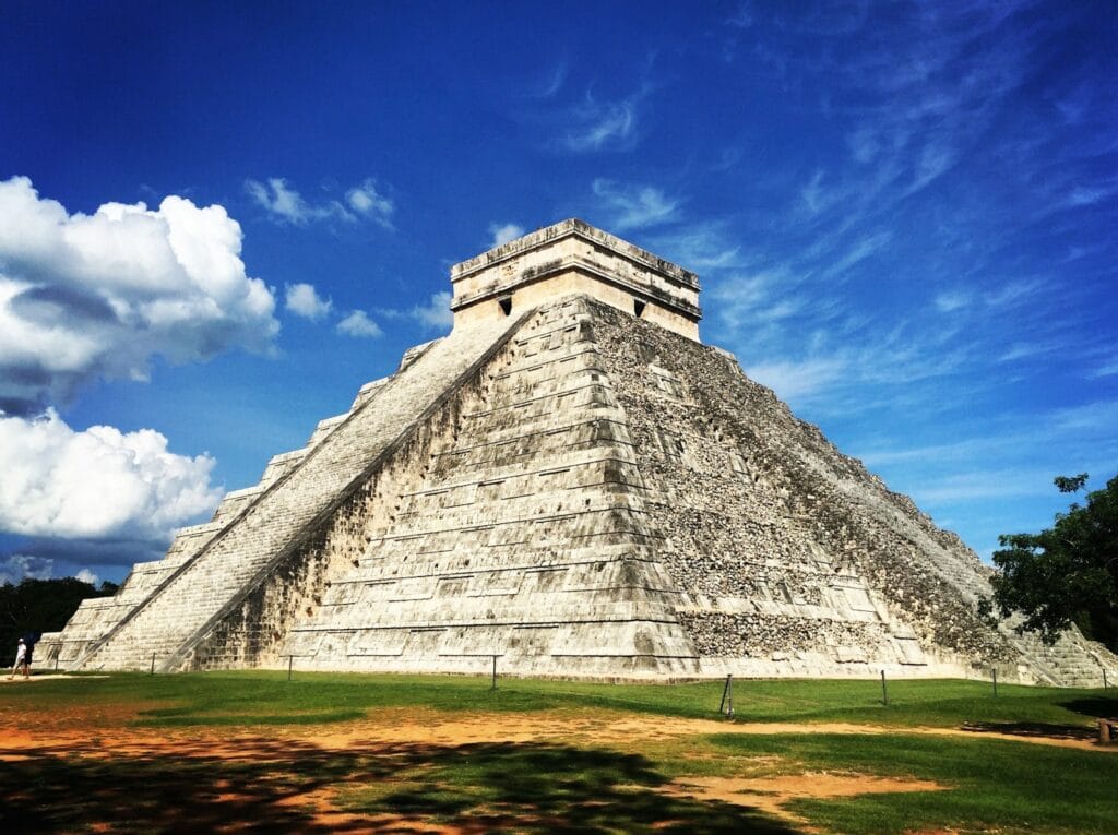 Chichen Itza gray pyramid under blue sky during daytime