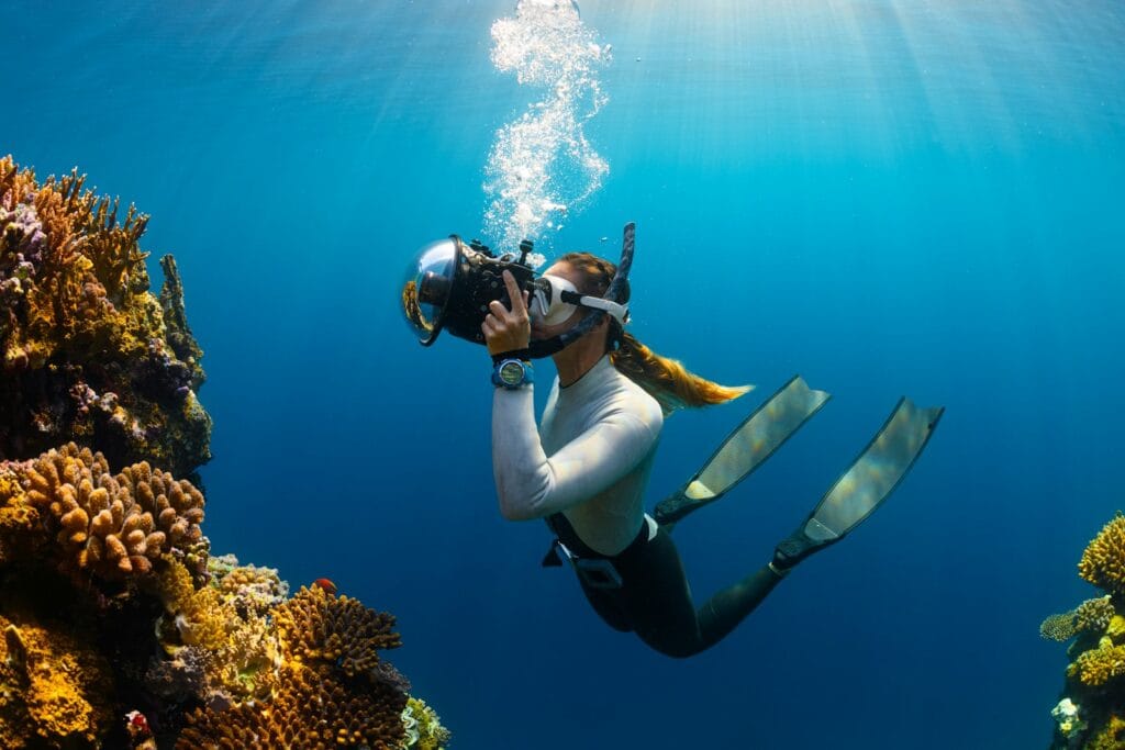 British Virgin Islands Tours snorkeling a woman scubas in the ocean with a camera
