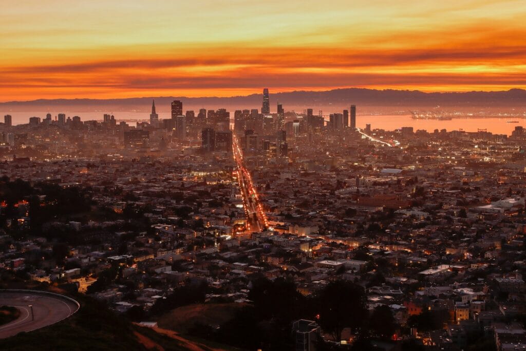 San Francisco Travel Guide An aerial view of a city at sunset