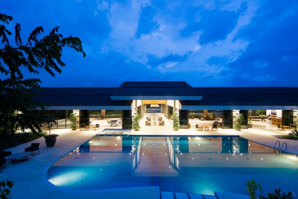 Hotellook hotels near me blue body of water in front of building near trees during nighttime