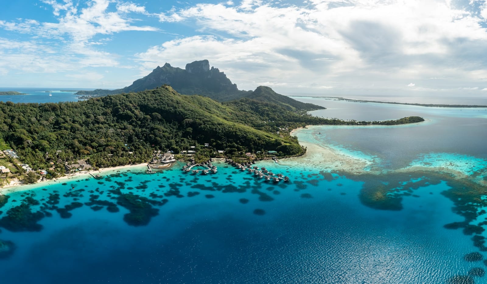 explore oceania an aerial view of a tropical island in the middle of the ocean