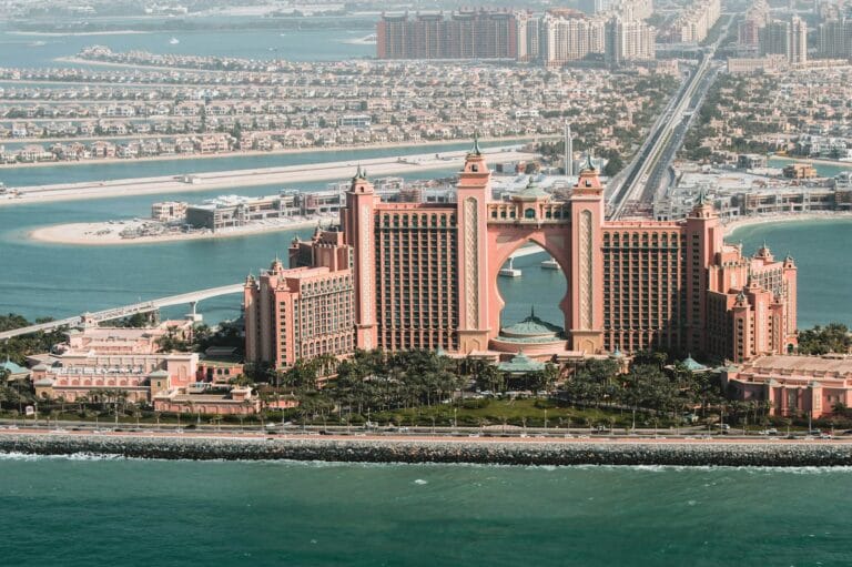 dubai tours brown concrete building near body of water during daytime