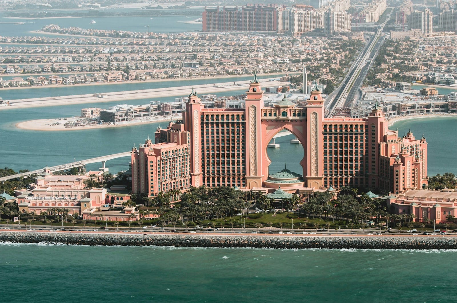 dubai tours brown concrete building near body of water during daytime