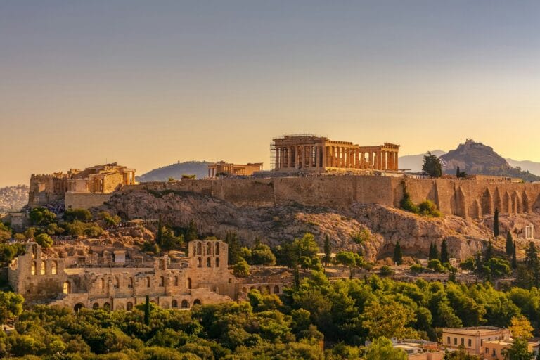 Greece Travel Guide brown concrete building under blue sky during daytime