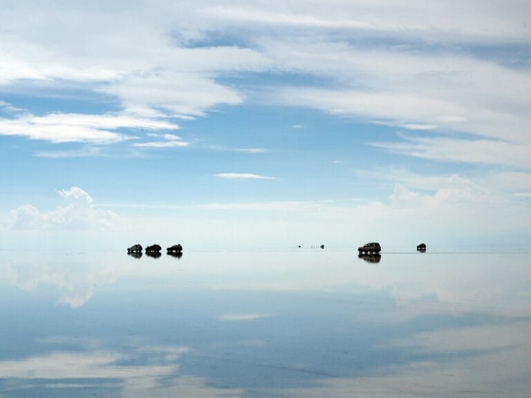 Global Surreal Wonders body of water under cloudy sky during daytime