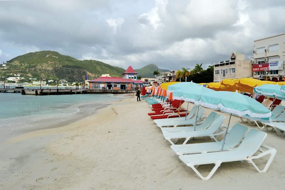St. Maarten Tours: Island Cruises, Hidden Beaches & Culture a boat sitting on top of a sandy beach