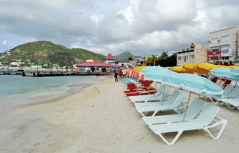 St. Maarten Tours: Island Cruises, Hidden Beaches & Culture a boat sitting on top of a sandy beach
