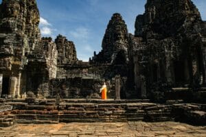 Siem Reap A person standing in front of a stone building