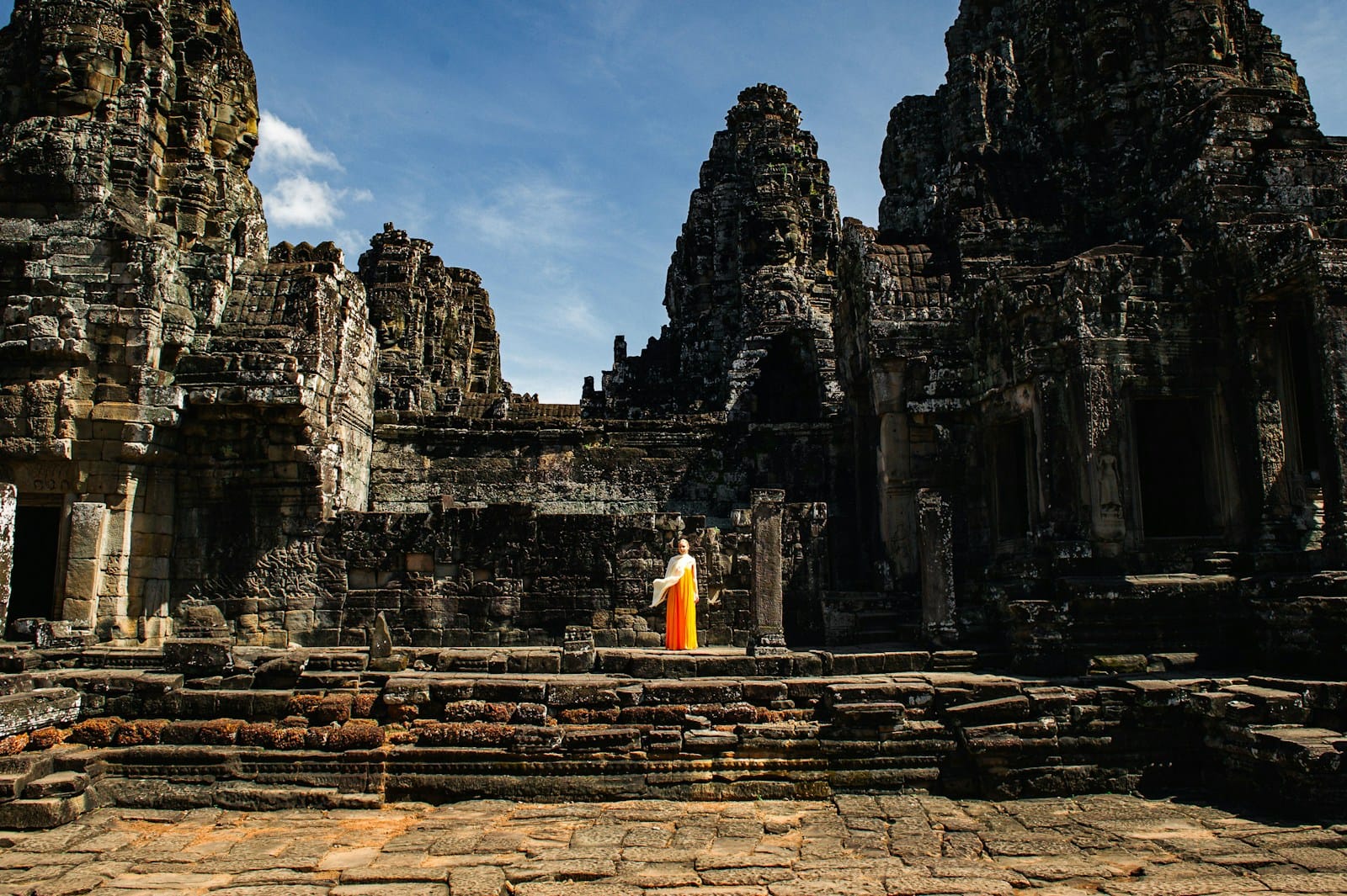 Siem Reap A person standing in front of a stone building