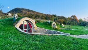 Kosovo Travel Guide A house made out of grass with a red door