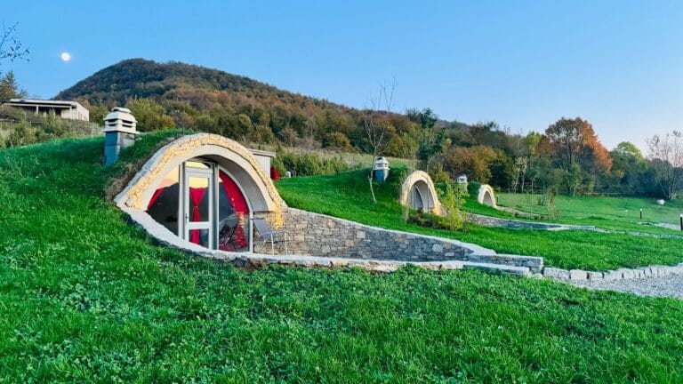 Kosovo Travel Guide A house made out of grass with a red door