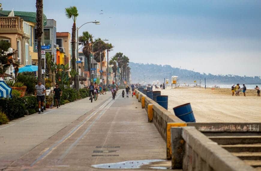 San Diego Tours people walking on sidewalk near body of water during daytime