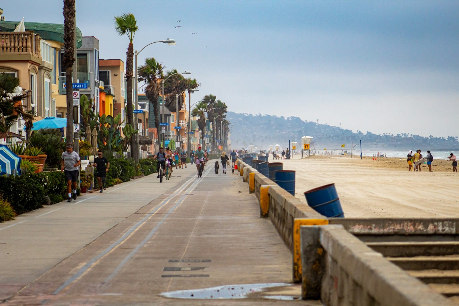 San Diego Tours people walking on sidewalk near body of water during daytime