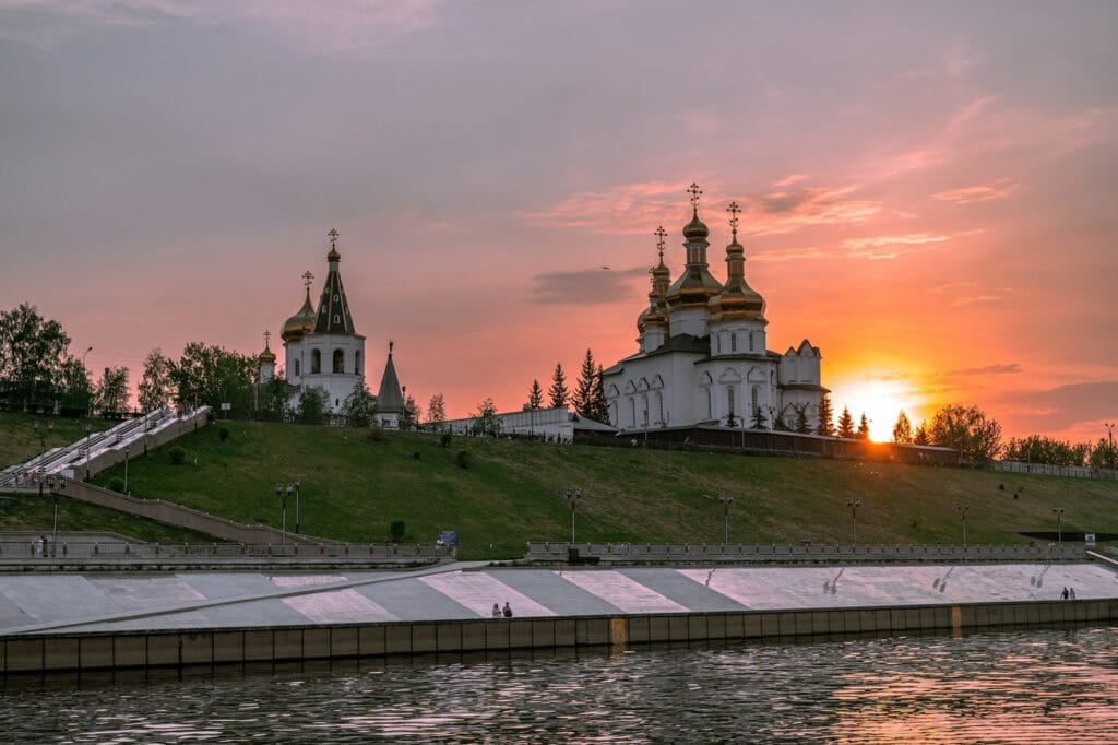 Russia Travel Guide white and brown concrete building under cloudy sky during sunset