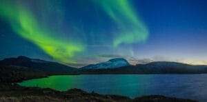 Sweden Tours aurora borealis over body of water during nighttime