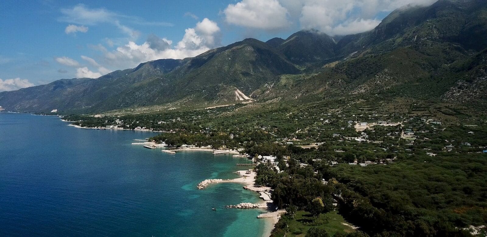 Haiti Tours town at the foot of mountain by the sea