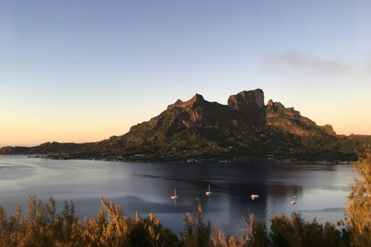 French Polynesia Travel Guide a large body of water surrounded by mountains