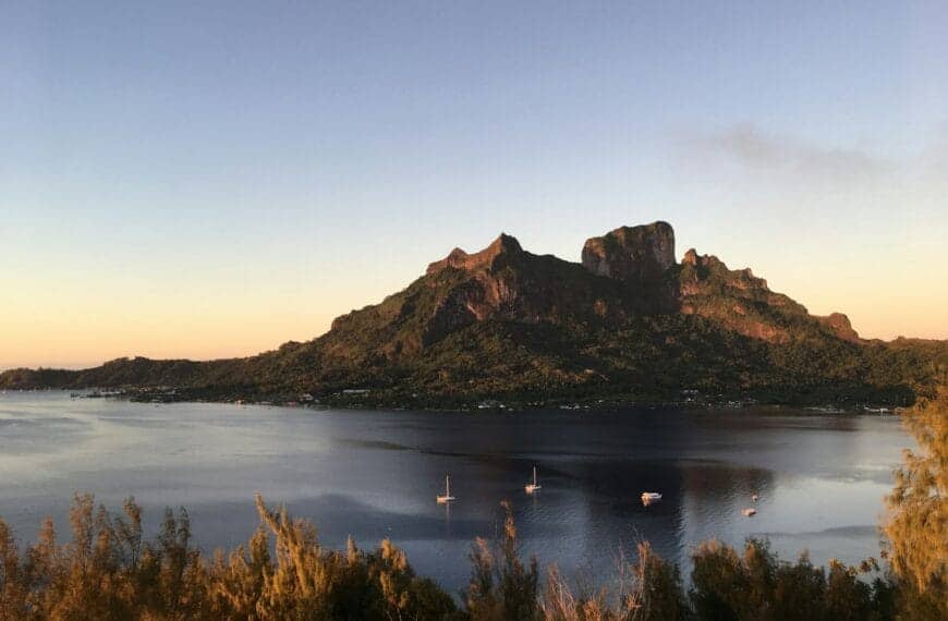 French Polynesia Travel Guide a large body of water surrounded by mountains