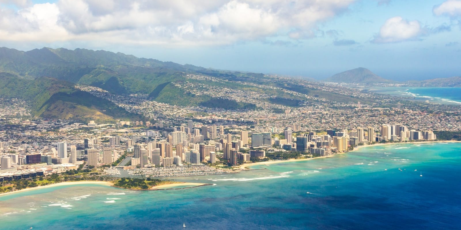 Honolulu Tours an aerial view of a city and the ocean
