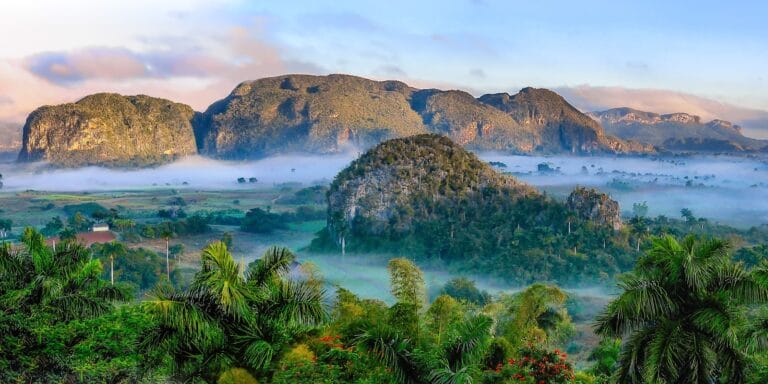 Cuba Travel Guide aerial photography of mountains and near trees during daytime
