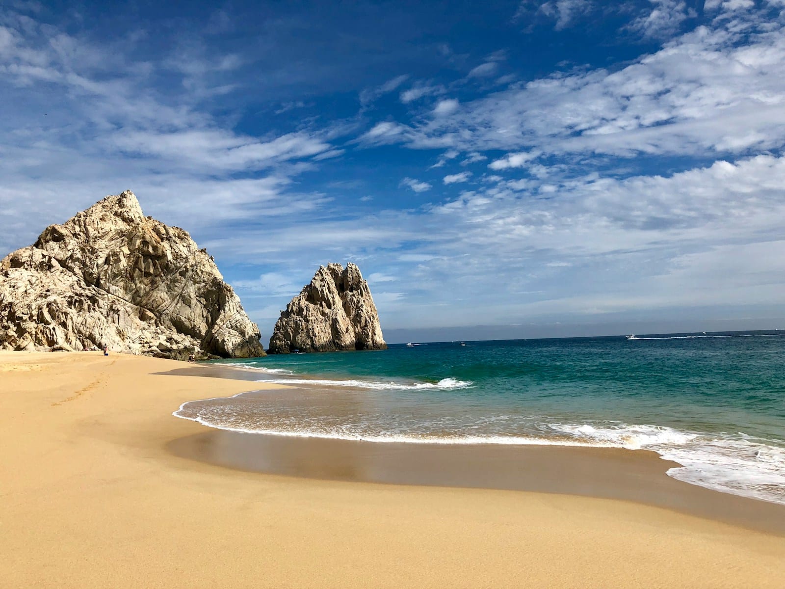 Los Cabos Tours brown rock formation on sea shore under blue sky and white clouds during daytime