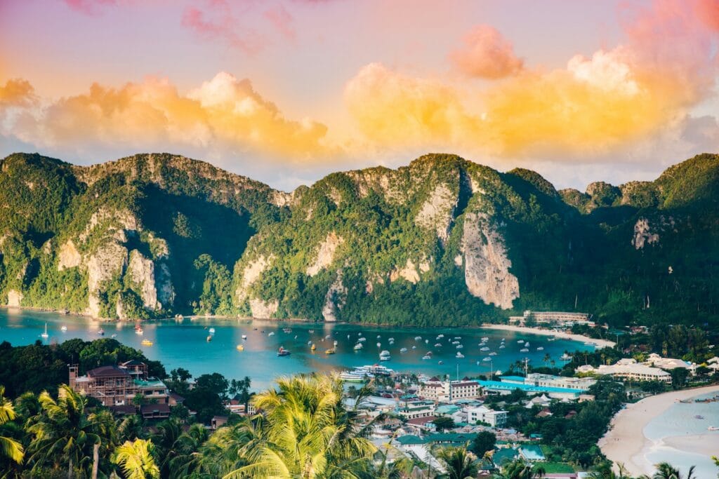 Thailand Tours aerial photography of body of water surrounded with mountains