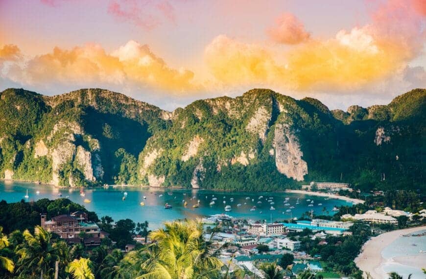 Thailand Tours aerial photography of body of water surrounded with mountains