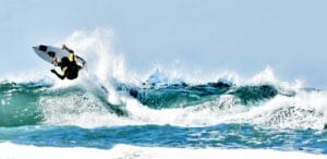 california travel guide person doing surfboard