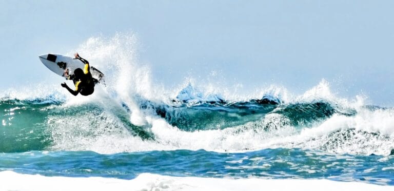 california travel guide person doing surfboard