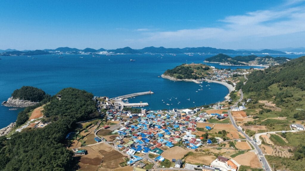 South Korea Tours: Palaces, K-Pop Streets & Scenic Escapes South Korea Tours a large body of water surrounded by a lush green hillside