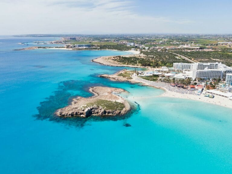 Cyprus Travel Guide aerial view of city buildings near body of water during daytime